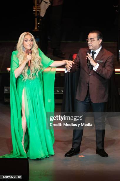 Special guest Yuri and Gilberto Santa Rosa perform during a concert at Auditorio Nacional on April 1, 2022 in Mexico City, Mexico.