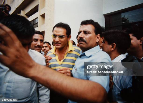 Former Indian Cricket team Captain Mohammad Azharuddin coming out after appearing before an inquiry on match-fixing charges in New Delhi.