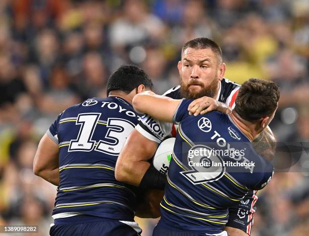 Jared Waerea-Hargreaves of the Roosters is tackled during the round four NRL match between the North Queensland Cowboys and the Sydney Roosters at...