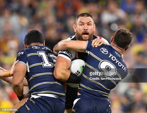 Jared Waerea-Hargreaves of the Roosters is tackled during the round four NRL match between the North Queensland Cowboys and the Sydney Roosters at...