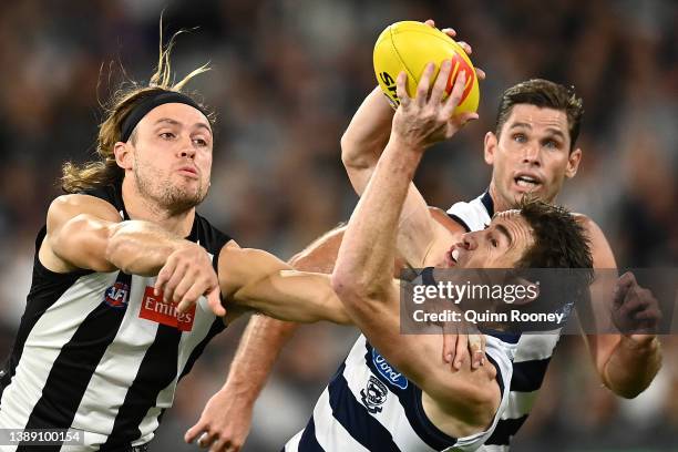 Jeremy Cameron of the Cats marks infront of Darcy Moore of the Magpies during the round three AFL match between the Collingwood Magpies and the...