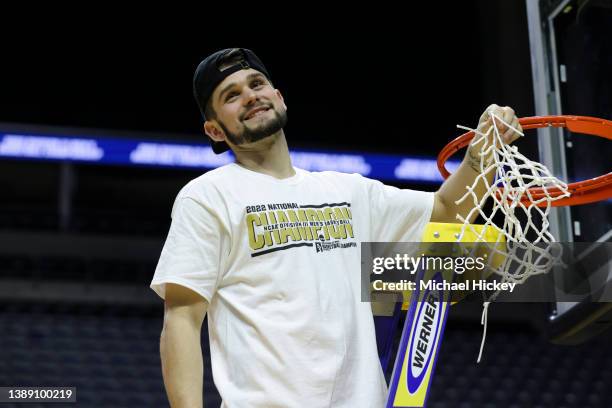 Buzz Anthony of the Randolph-Macon Yellow Jackets cuts the net after defeating the Elmhurst Bluejays to win the Division III Men's Basketball...