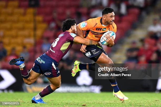 Irae Simone of the Brumbies is tackled during the round seven Super Rugby Pacific match between the Queensland Reds and the ACT Brumbies at Suncorp...