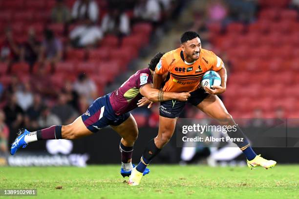 Irae Simone of the Brumbies is tackled during the round seven Super Rugby Pacific match between the Queensland Reds and the ACT Brumbies at Suncorp...