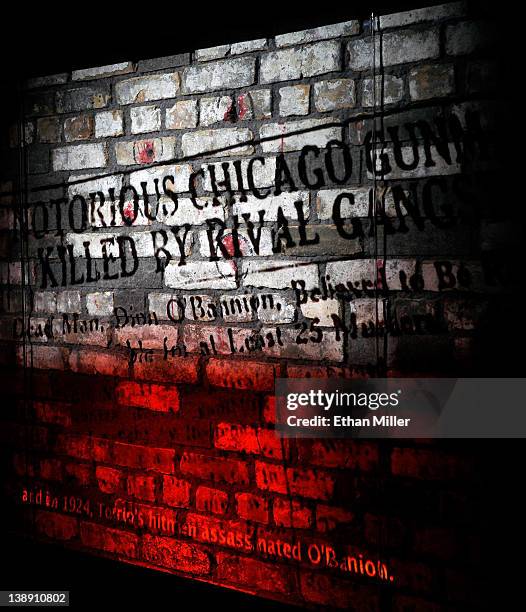 Video is projected on a piece of the brick wall from the February 14 St. Valentine's Day Massacre as part of a display at The Mob Museum February 13,...