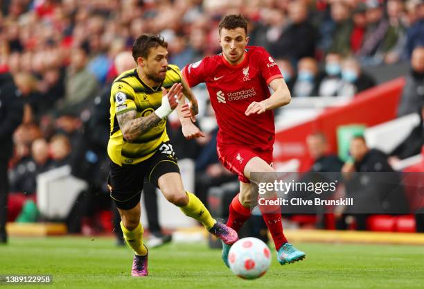 Diogo Jota of Liverpool battles for possession with Kiko Femenia of Watford FC during the Premier League match between Liverpool and Watford at...