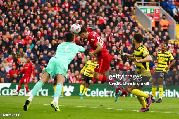 Diogo Jota of Liverpool scores their team's first goal past Kiko Femenia and Ben Foster of Watford FC during the Premier League match between...