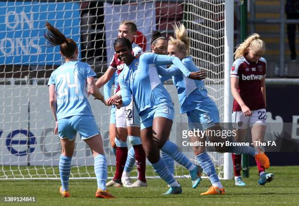 Khadija Shaw of Manchester City celebrates with teammates Alex Greenwood and Keira Walsh after scoring their side's second goal during the Barclays...