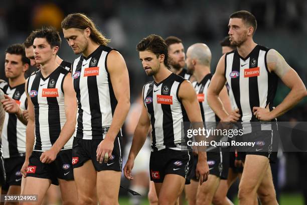 The Magpies look dejected after losing the round three AFL match between the Collingwood Magpies and the Geelong Cats at Melbourne Cricket Ground on...