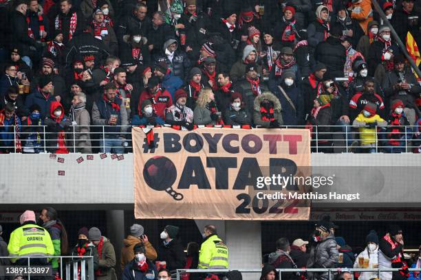 Fans of Freiburg display a banner about boycotting the FIFA World Cup 2022 in Qatar prior to the Bundesliga match between Sport-Club Freiburg and FC...