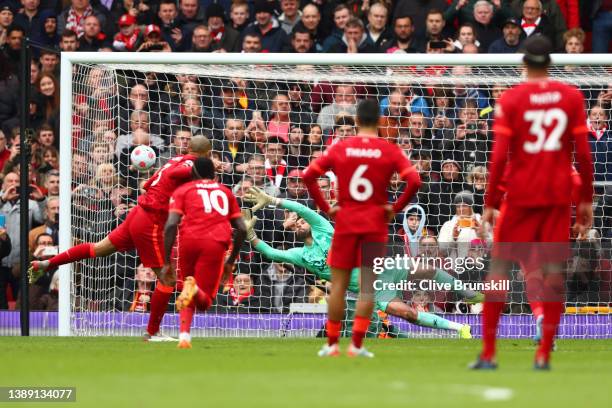 Ben Foster of Watford FC fails to save a penalty shot from Fabinho of Liverpool which results in the second goal for Liverpool during the Premier...