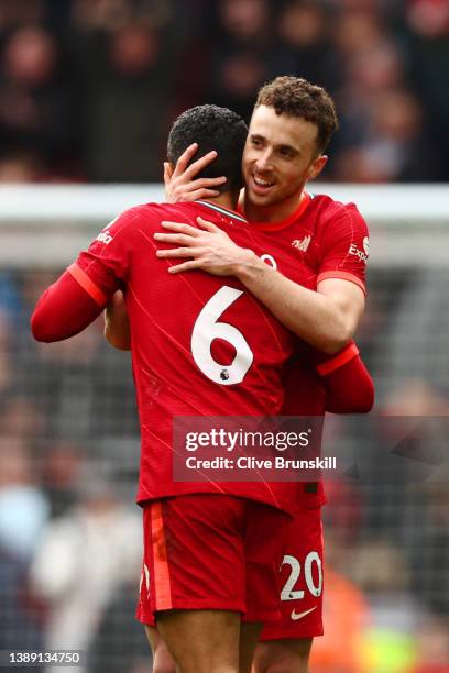 Thiago Alcantara and Diogo Jota of Liverpool celebrate following their side's victory in the Premier League match between Liverpool and Watford at...