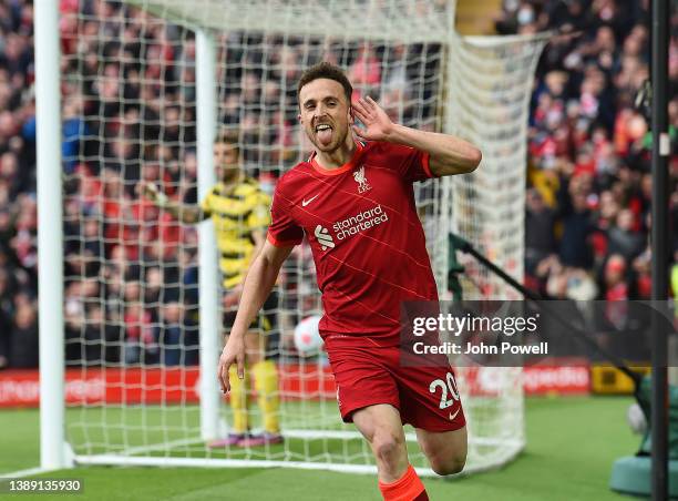 Diogo Jota of Liverpool celebrates after scoring the opening goal during the Premier League match between Liverpool and Watford at Anfield on April...