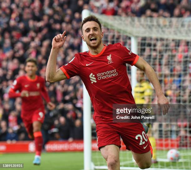 Diogo Jota of Liverpool celebrates after scoring the opening goal during the Premier League match between Liverpool and Watford at Anfield on April...