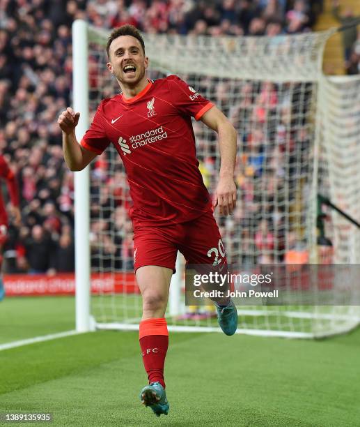 Diogo Jota of Liverpool celebrates after scoring the opening goal during the Premier League match between Liverpool and Watford at Anfield on April...