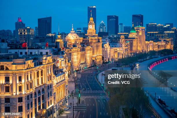 Aerial view of illuminated buidlings at the empty Bund after Shanghai imposed a citywide lockdown to halt the spread of COVID-19 epidemic on April 1,...