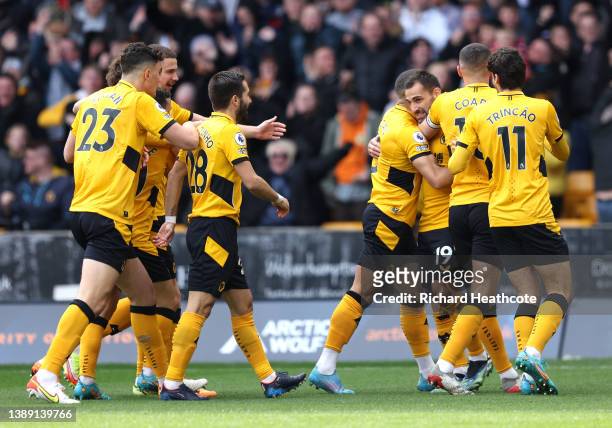 Jonny Otto of Wolverhampton Wanderers celebrates after scoring their side's first goal with teammates during the Premier League match between...