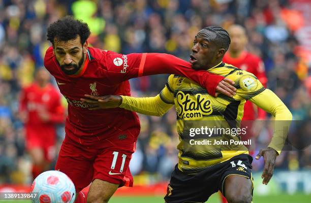 Sadio Mane of Liverpool with Hassane Kamara of Watford in action during the Premier League match between Liverpool and Watford at Anfield on April...