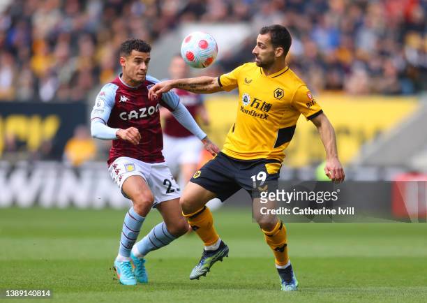 Jonny Otto of Wolverhampton Wanderers battles for possession with Philippe Coutinho of Aston Villa during the Premier League match between...
