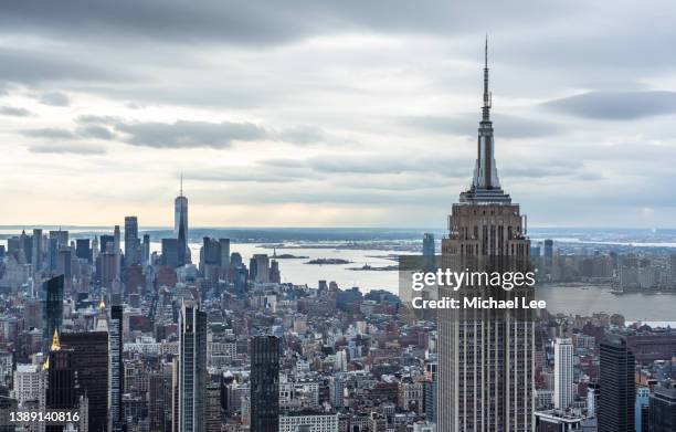 dramatic high angle new york skyline - day and night image series stock pictures, royalty-free photos & images