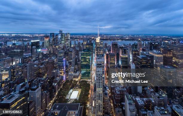 high angle view of midtown manhattan in new york at twilight - ice rink overhead stock pictures, royalty-free photos & images