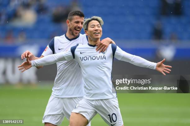 Takuma Asano of VfL Bochum celebrates after scoring his team`s first goal with teammate Anthony Losilla of VfL Bochum during the Bundesliga match...