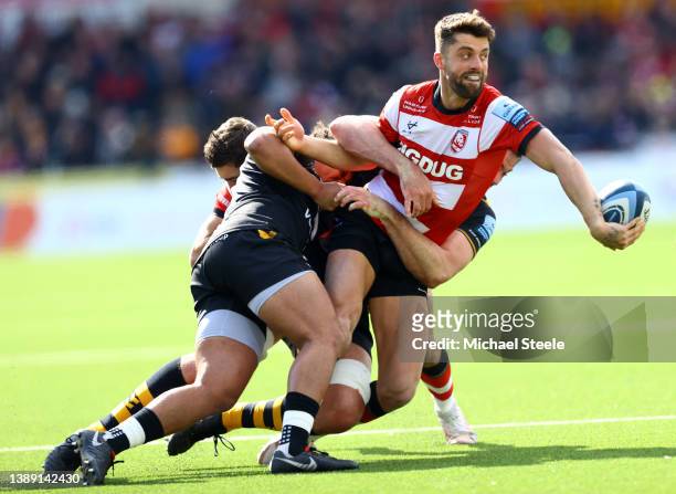 Adam Hastings of Gloucester releases a pass under pressure during the Gallagher Premiership Rugby match between Gloucester Rugby and Wasps at...