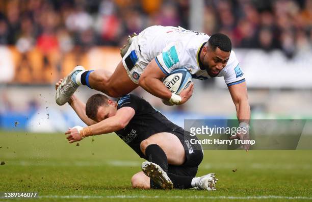 Joe Cokanasiga of Bath Rugby is tackled by Joe Simmonds of Exeter Chiefs during the Gallagher Premiership Rugby match between Exeter Chiefs and Bath...