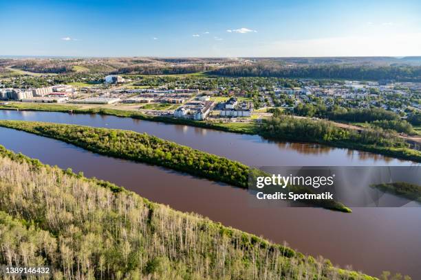 aerial ft mcmurray oil refinery athabasca river canada - fort mcmurray stock pictures, royalty-free photos & images
