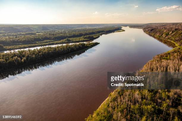 aerial athabasca river near ft mc murray canada - fort mcmurray canada stock pictures, royalty-free photos & images