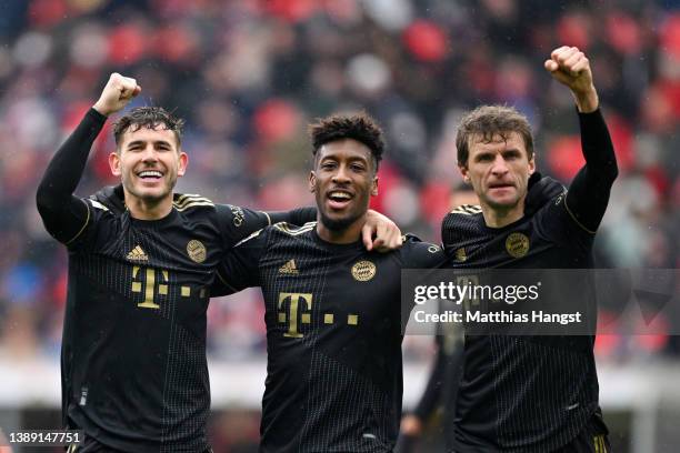 Lucas Hernandez, Kingsley Coman and Thomas Mueller of FC Bayern Muenchen celebrate after Kingsley Coman scored their side's third goal during the...
