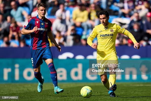 Daniel Parejo of Villarreal CF being followed by Nemanja Radoja of Levante UD during the LaLiga Santander match between Levante UD and Villarreal CF...