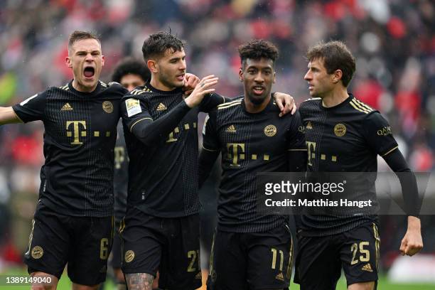 Joshua Kimmich, Lucas Hernandez, Kingsley Coman and Thomas Mueller of FC Bayern Muenchen celebrate after Kingsley Coman scored their side's third...