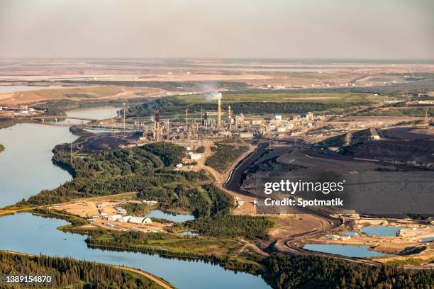 aerial view of large petrochemical oil refinery canada - oil sands stock pictures, royalty-free photos & images