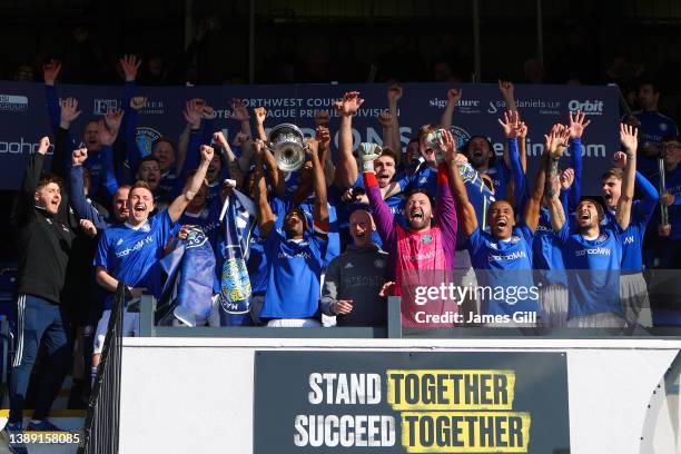 Macclesfield FC players lift the North West Counties Premier Division trophy after the North West Counties Football League match between Macclesfield...