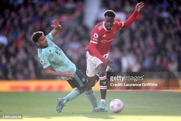 Anthony Elanga of Manchester United is challenged by James Justin of Leicester City during the Premier League match between Manchester United and...