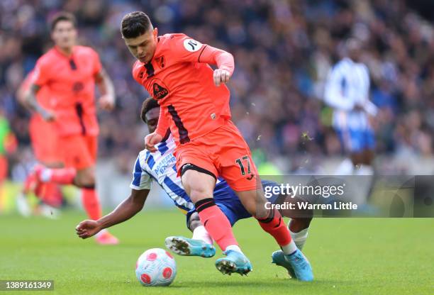 Tariq Lamptey of Brighton & Hove Albion battles for possession with Milot Rashica of Norwich City during the Premier League match between Brighton &...