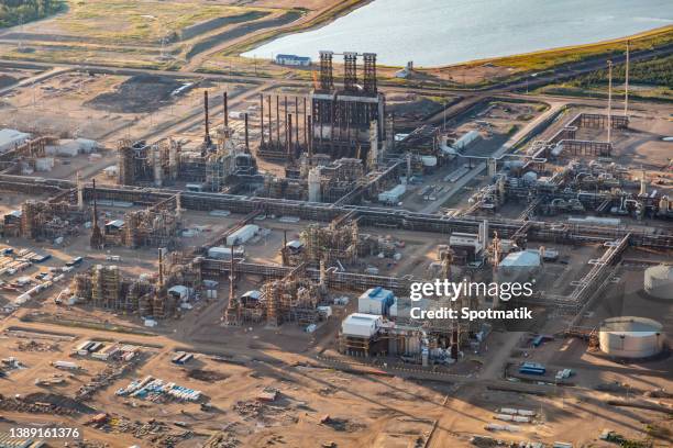 aerial view oil refinery storage plant tar sands - fort mcmurray stock pictures, royalty-free photos & images