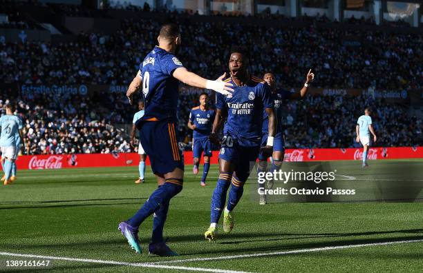 Karim Benzema of Real Madrid celebrates after scoring their first goal from the penalty spot during the LaLiga Santander match between RC Celta de...