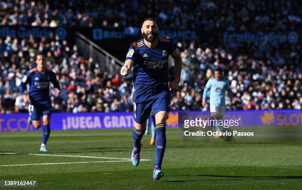 Karim Benzema of Real Madrid celebrates after scoring their first goal from the penalty spot during the LaLiga Santander match between RC Celta de...