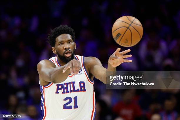 Joel Embiid of the Philadelphia 76ers passes during the first quarter against the Charlotte Hornets at Wells Fargo Center on April 02, 2022 in...