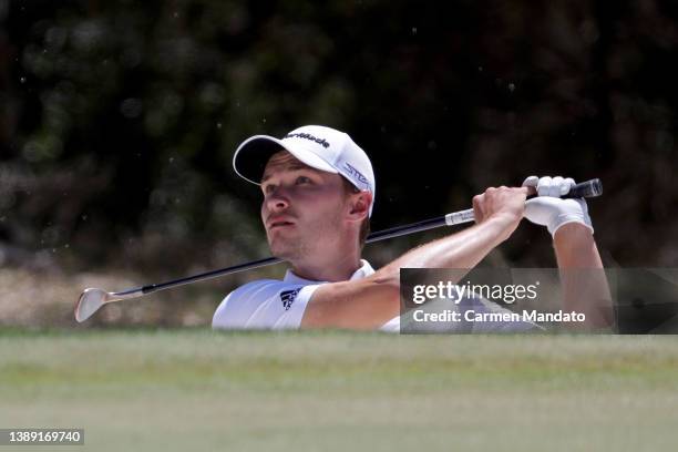 Rasmus Hojgaard of Denmark plays his shot from the bunker on the eighth hole during the third round of the Valero Texas Open at TPC San Antonio on...