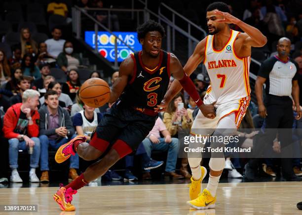 Caris LeVert of the Cleveland Cavaliers drive against Timothe Luwawu-Cabarrot of the Atlanta Hawks during the first half at State Farm Arena on...
