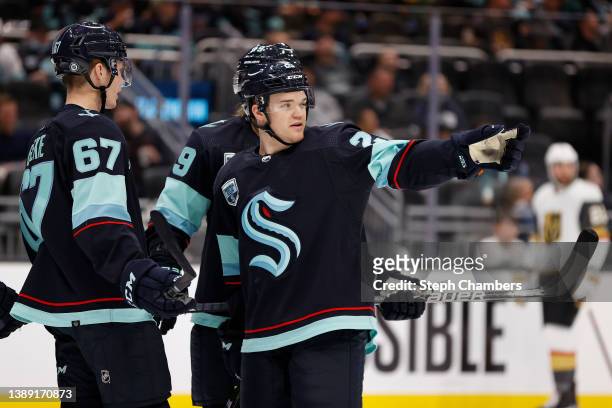 Karson Kuhlman of the Seattle Kraken talks with teammates during the third period against the Vegas Golden Knights at Climate Pledge Arena on April...