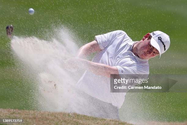 Robert MacIntyre of Scotland plays his shot from the bunker on the eighth hole during the third round of the Valero Texas Open at TPC San Antonio on...