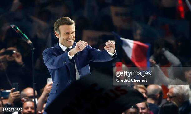 French President and liberal party ‘La Republique en Marche’ candidate for his re-election in the 2022 presidential election, Emmanuel Macron waves...