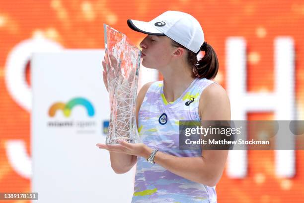 Iga Swiatek of Poland poses with the Butch Buchholz trophy after defeating Naomi Osaka of Japan during the women's final of the Miami Open at Hard...