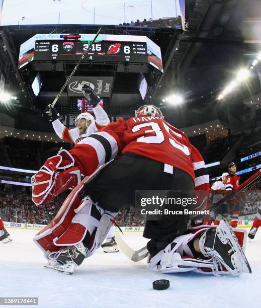 Sam Bennett of the Florida Panthers celebrates the game-winning overtime goal by Gustav Forsling against Andrew Hammond of the New Jersey Devils at...