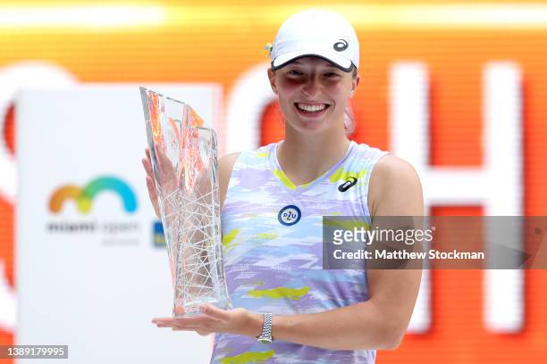 Iga Swiatek of Poland poses with the Butch Buchholz trophy after defeating Naomi Osaka of Japan during the women's final of the Miami Open at Hard...