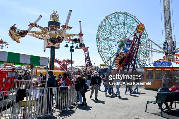 People visit Luna Park on the opening day of the season at Coney Island on April 2, 2022 in the Brooklyn Borough of New York City. The annual opening...